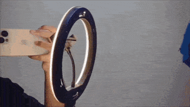 a man wearing sunglasses is taking a picture of himself with an iphone