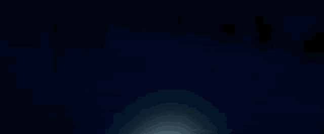 a light shines through a dark blue background