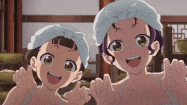 two anime girls wearing towels on their head are smiling