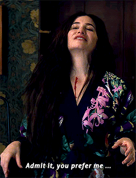 a woman in a floral robe says " admit it you prefer me ... "