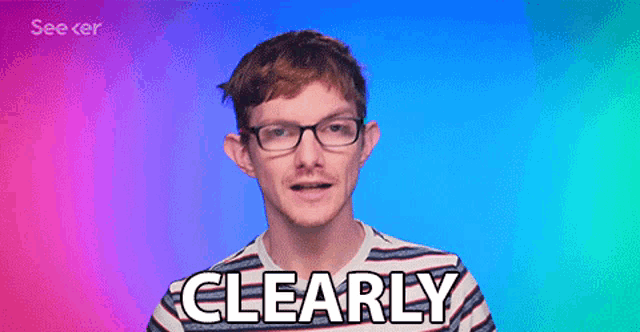 a man wearing glasses says clearly in front of a blue background