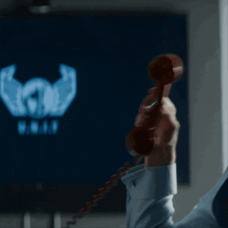a person holding a red telephone in front of a screen that says ' 8888 '