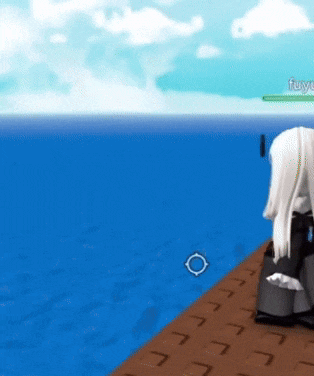 a person is sitting on a dock in front of a body of water with the name fuyu on the bottom left