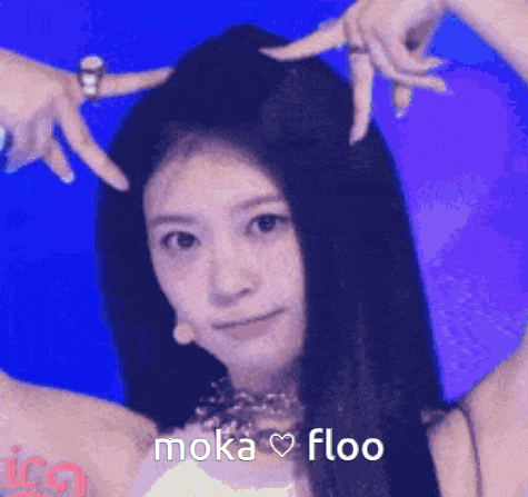 a close up of a woman 's head with the words moka floo above her