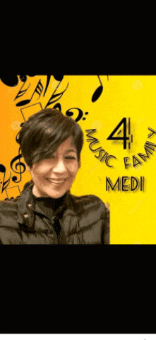 a woman in a black jacket is smiling in front of a yellow background that says music family