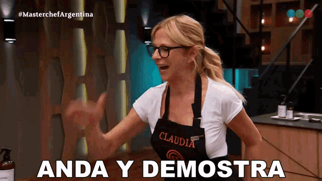 a woman wearing a black apron that says claudia