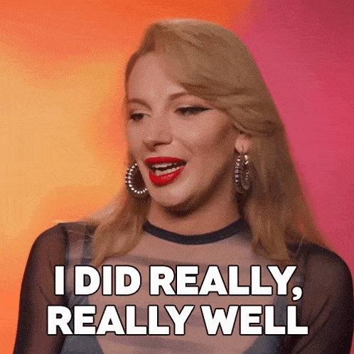a woman says " i did really really well " while wearing hoop earrings
