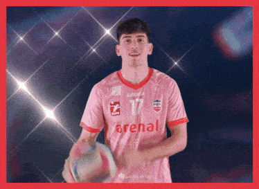 a man wearing a pink jersey with arenal written on it