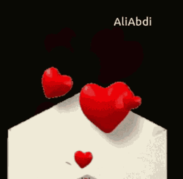 two red hearts coming out of an envelope with the name aliabdi