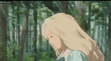 a girl with blonde hair is standing in a forest with her eyes closed .