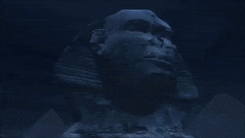 a statue of a man 's face is surrounded by a green light
