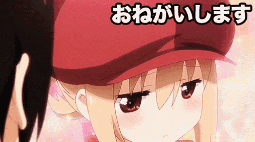 a girl wearing a red hat is looking at a man in a red shirt