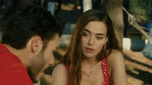 a man and a woman sitting next to each other