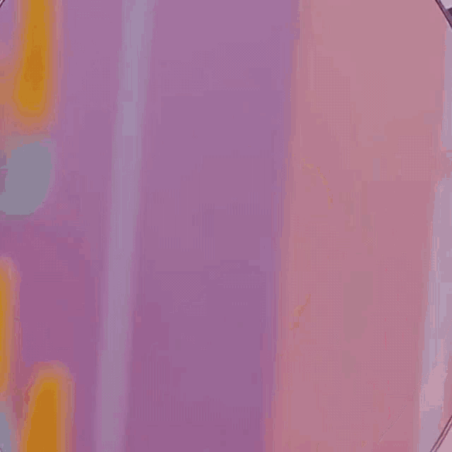 a close up of a woman 's face with her mouth open and pink hair .