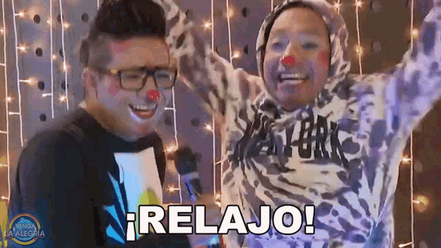 a couple of clowns are standing next to each other and one of them says relajo