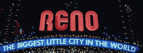 a neon sign that says reno is lit up at night