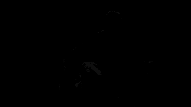 a man playing a guitar in a black and white photo