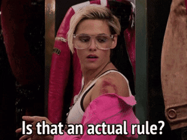 a woman wearing glasses and a pink jacket asks is that an actual rule