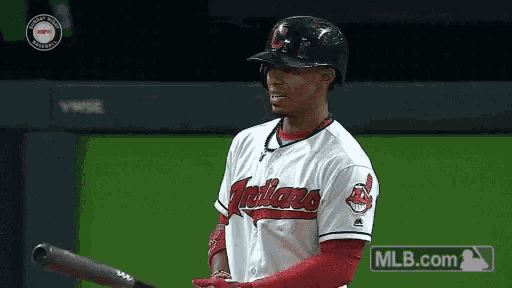 a baseball player with the word indians on his shirt