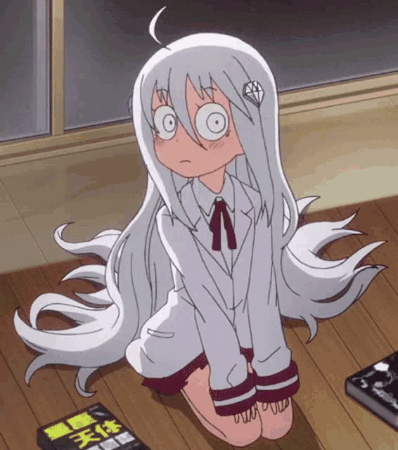 a girl with long white hair is kneeling down next to a book with chinese writing