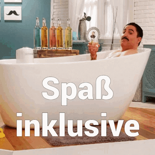 a man is sitting in a bathtub with the words spaß inklusive written below him