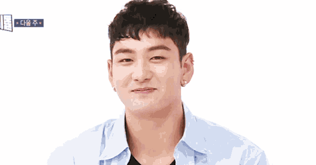 a man is smiling and holding his hands to his face with hearts on his wrists