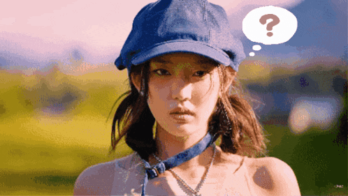 a woman wearing a blue hat has a question mark in her thought bubble