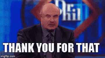 a man in a suit and tie is sitting in front of a screen that says thank you for that .