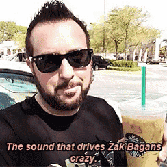 a man wearing sunglasses is holding a cup of coffee with the words " the sound that drives zak bagans crazy " below him