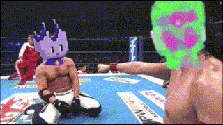 a man with a purple crown on his head is kneeling down in a boxing ring with a green mask on his head
