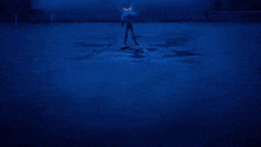 a close up of a person 's face with a blue background