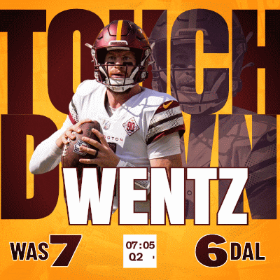 a football player is holding a ball in front of a sign that says touch down was 7
