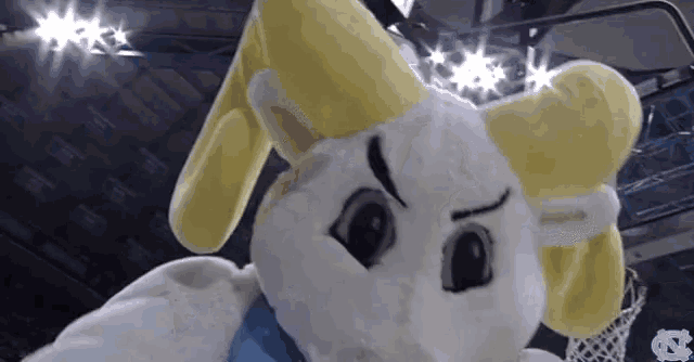 a mascot with the letter n on the bottom