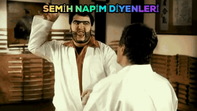 two men are fighting in a room with the words semih napim diyenleri written above them