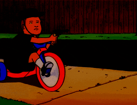a cartoon character riding a tricycle with a gun in his hand