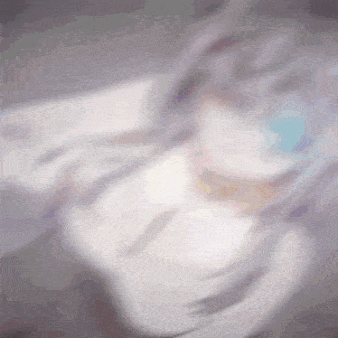 a blurry picture of a person 's face with a blue eye