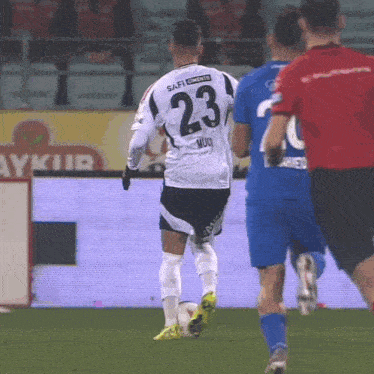 a soccer player with the number 23 on his shirt