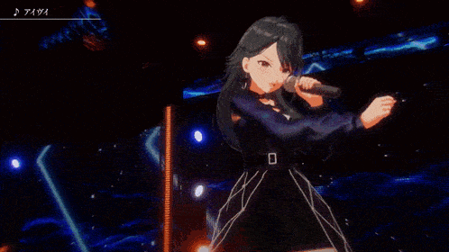 a girl in a black dress is singing into a microphone in front of a stage