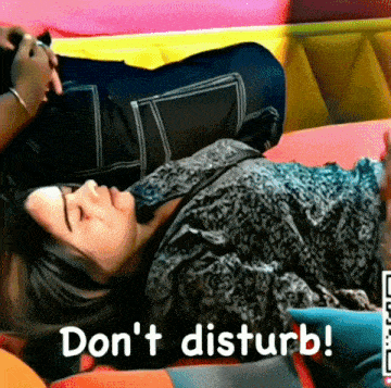 a woman is laying on a couch with the words " do n't disturb " on the bottom