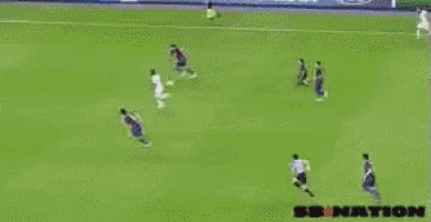a soccer game is being played in front of a banner that says open your world
