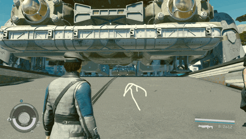 a man in a video game is standing in front of a large rocket ship