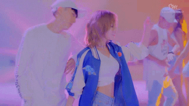 a woman in a blue jacket with the word hawaii on the sleeves