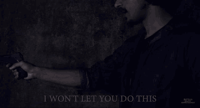 a man holding a gun with the words " i won 't let you do this " above him