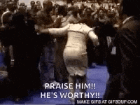 a woman in a dress is dancing in front of a crowd .