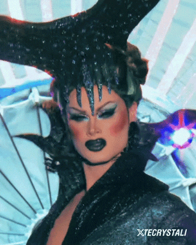 a close up of a woman with xtecrystali written on the bottom right