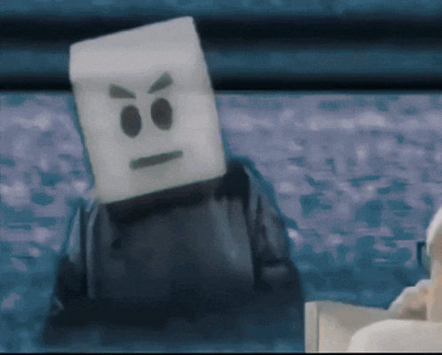 a marshmallow with an angry face on it is sitting on a table