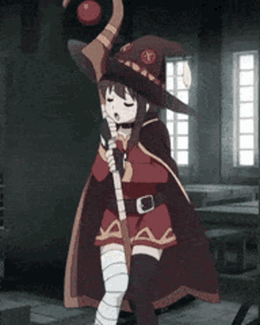 a girl in a witch costume is singing into a microphone while holding a cane .