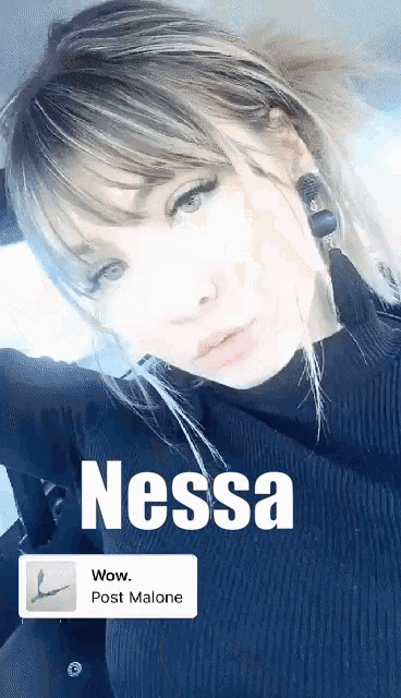 a woman named nessa is wearing a black top