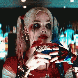 harley quinn from suicide squad drinking a martini