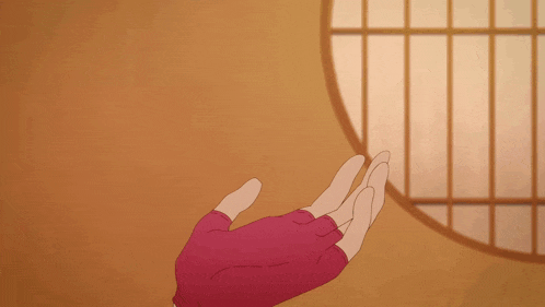 a person wearing a red glove is pointing to something